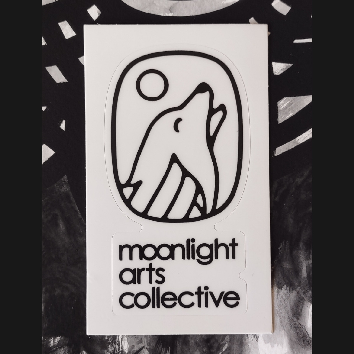 moonlight arts collective sticker - black logo on white background