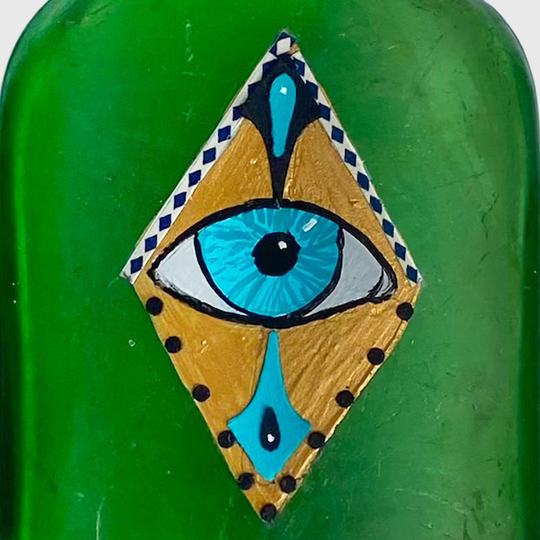 green bottle with eye